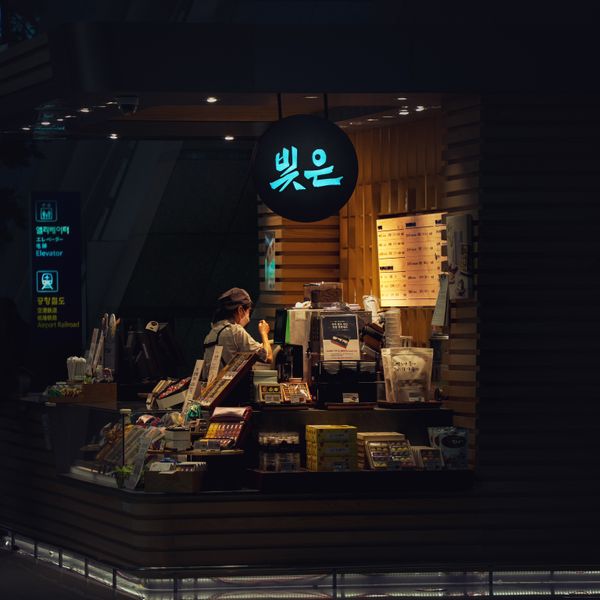The shop at night, seen through the window